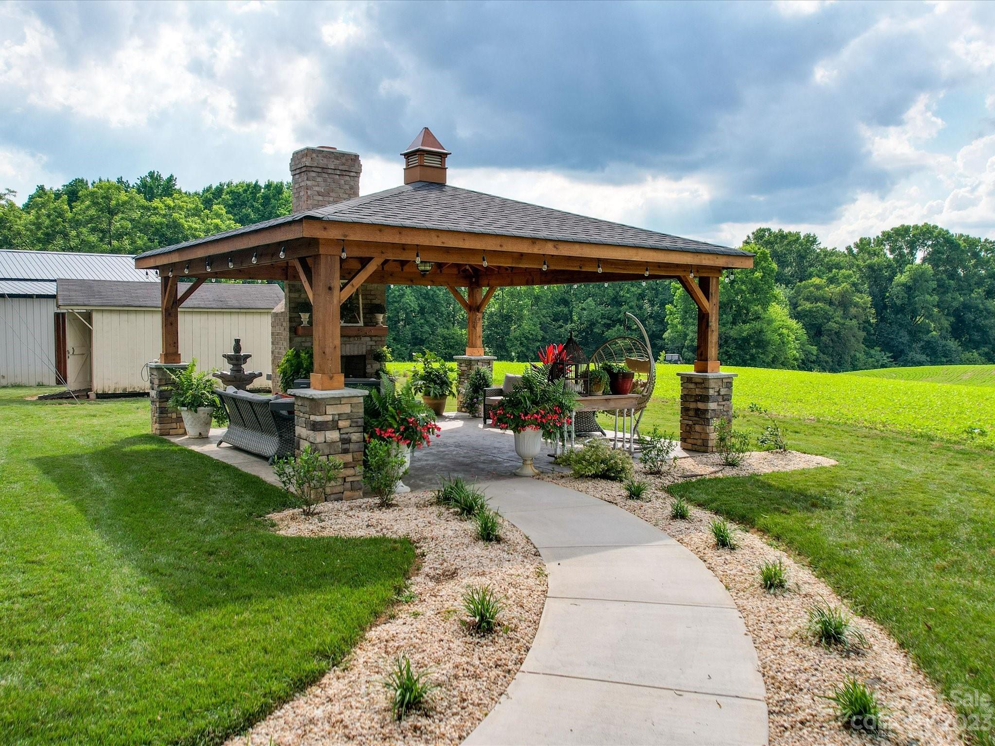 5817 Unionville Road Monroe, NC 28110 - Photo 15 of 46 a view of a porch with furniture and garden