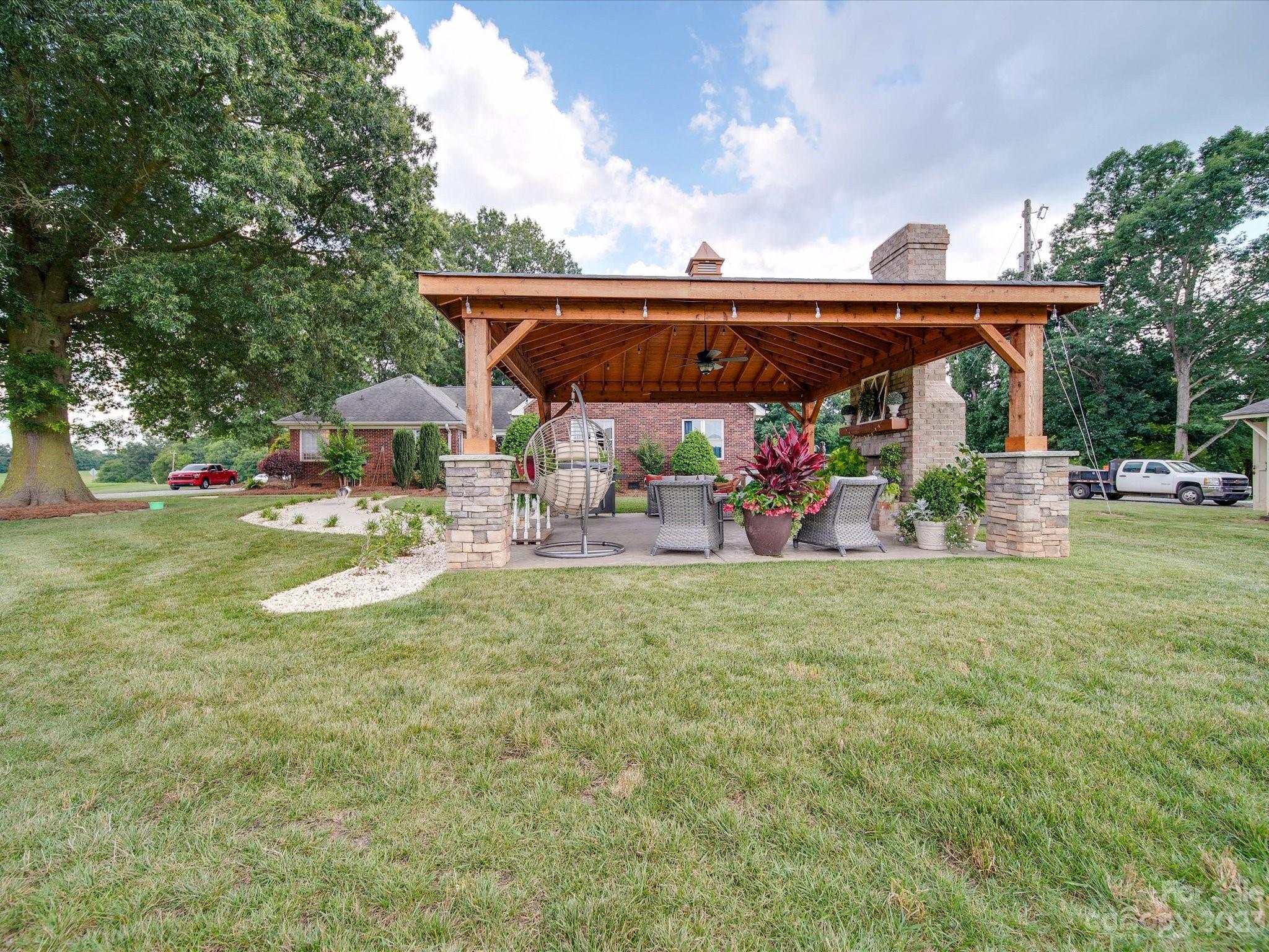 5817 Unionville Road Monroe, NC 28110 - Photo 16 of 46 a view of a patio with furniture and garden