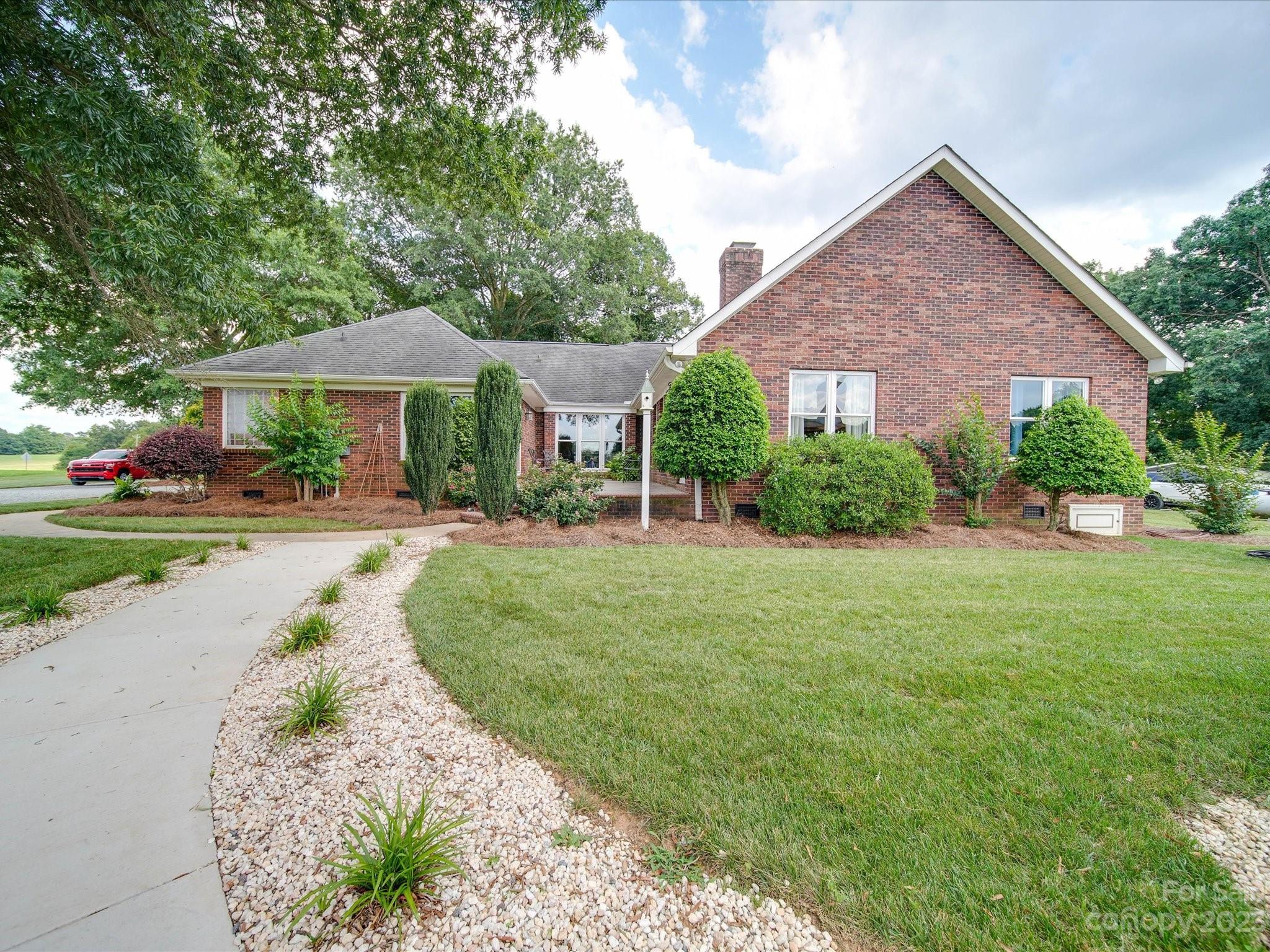 5817 Unionville Road Monroe, NC 28110 - Photo 18 of 46 a front view of a house with a yard