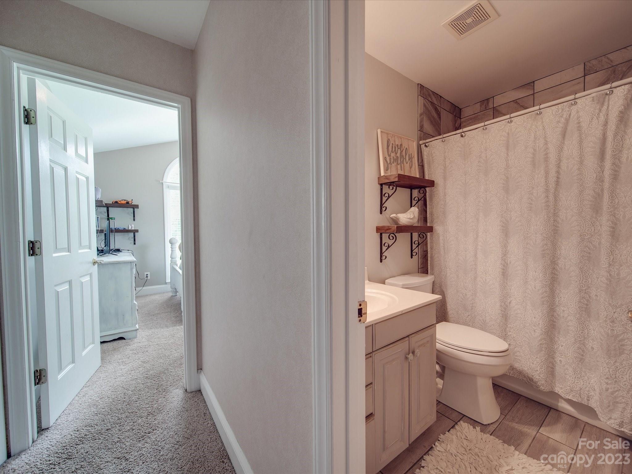 5817 Unionville Road Monroe, NC 28110 - Photo 41 of 46 a bathroom with a granite countertop sink a toilet and shower