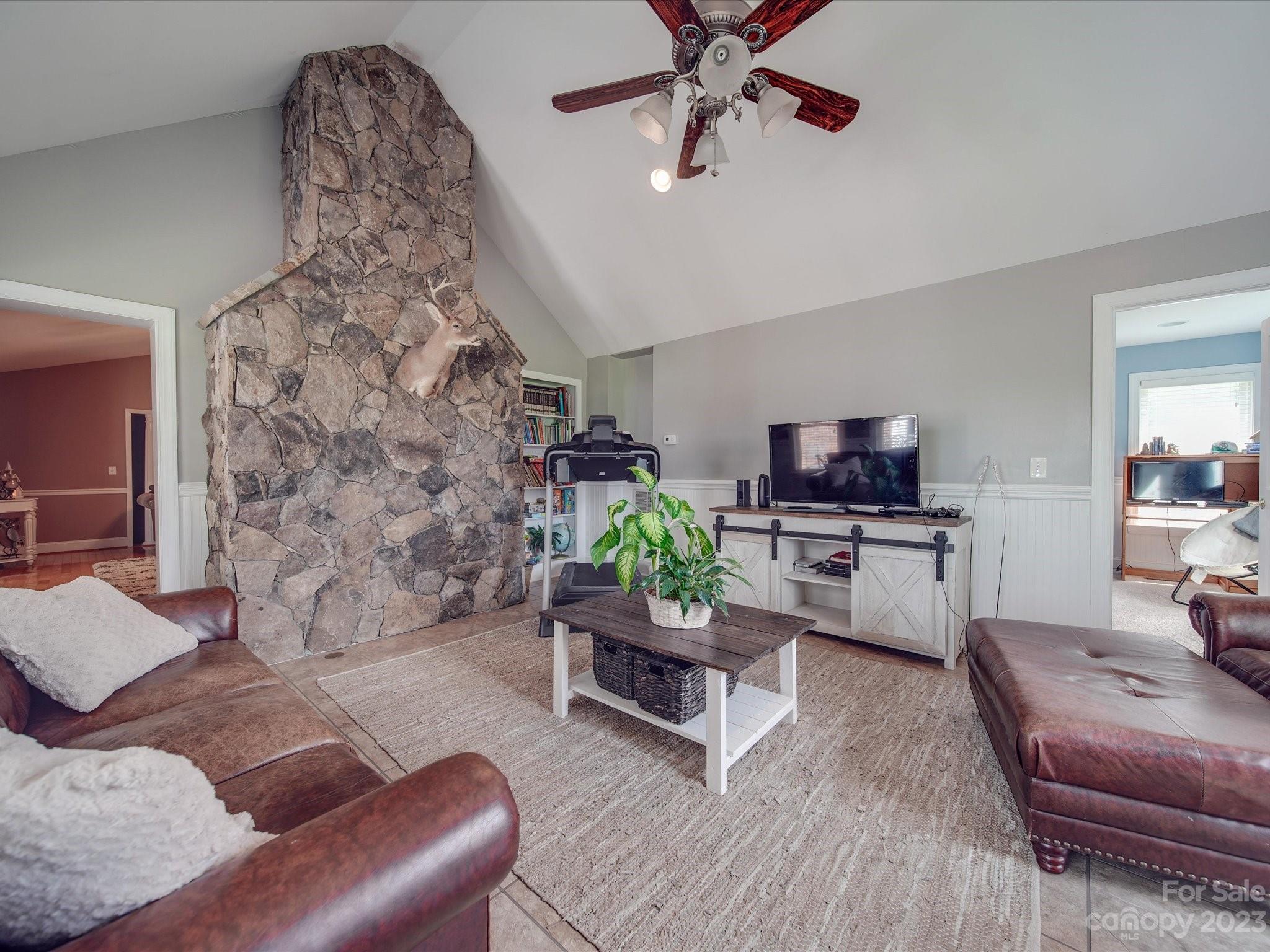 5817 Unionville Road Monroe, NC 28110 - Photo 43 of 46 a living room with furniture and a flat screen tv