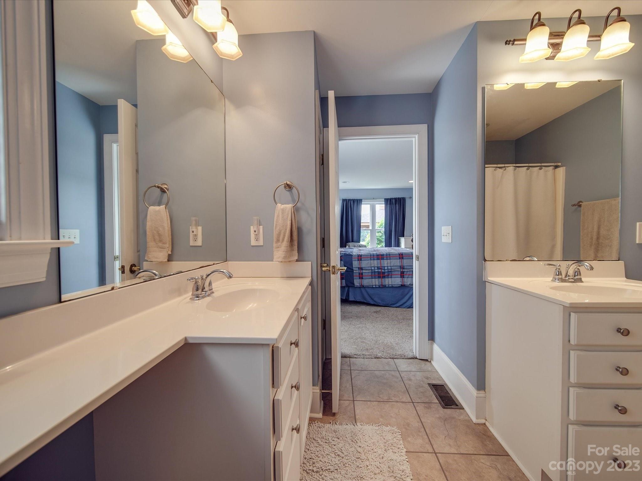 5817 Unionville Road Monroe, NC 28110 - Photo 46 of 46 a en suite bathroom with a sink and a mirror