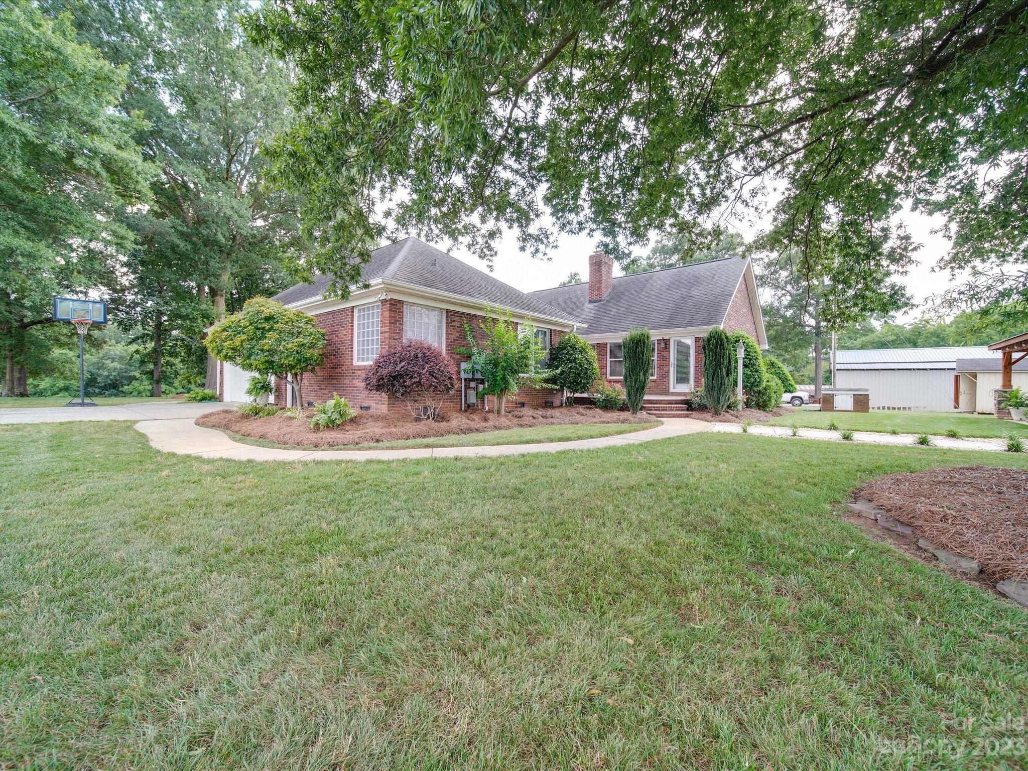 5817 Unionville Road Monroe, NC 28110 - Photo 7 of 46 a view of a house with a yard