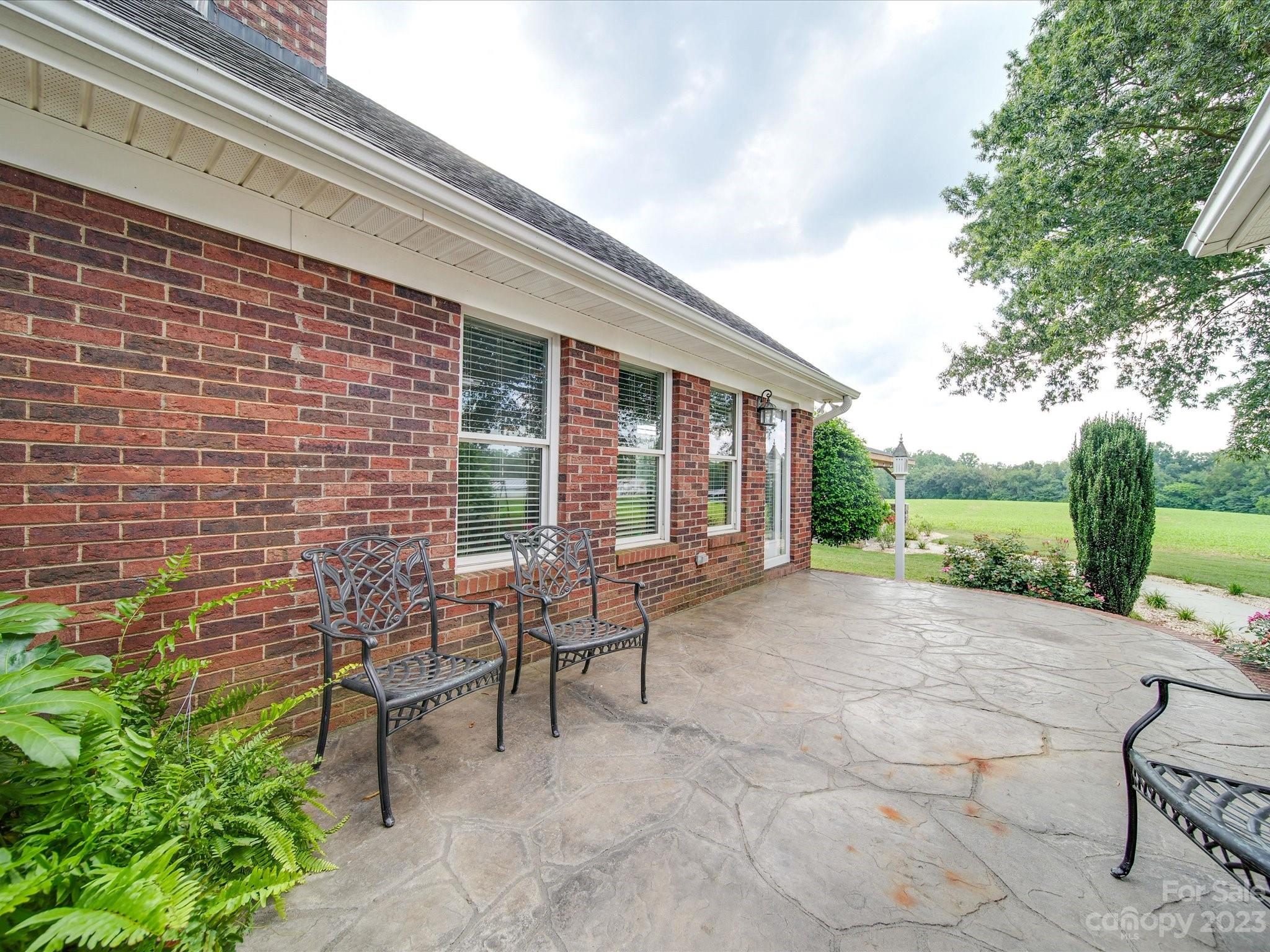 5817 Unionville Road Monroe, NC 28110 - Photo 10 of 46 a view of a house with backyard and sitting area