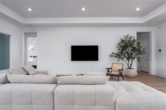 a living room with couches and a flat screen tv