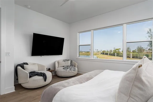 a bedroom with a bed and a lamp