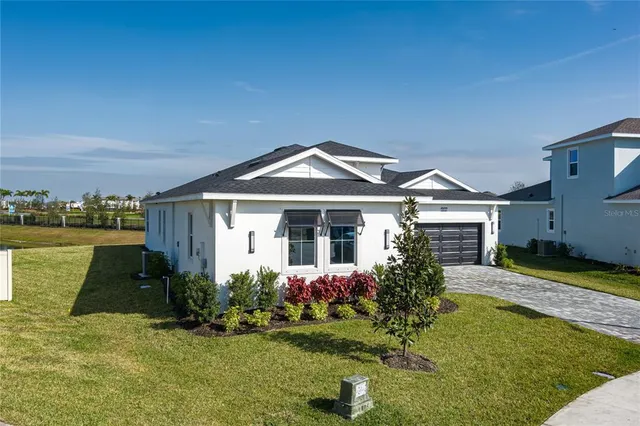 an aerial view of a house with a ocean view