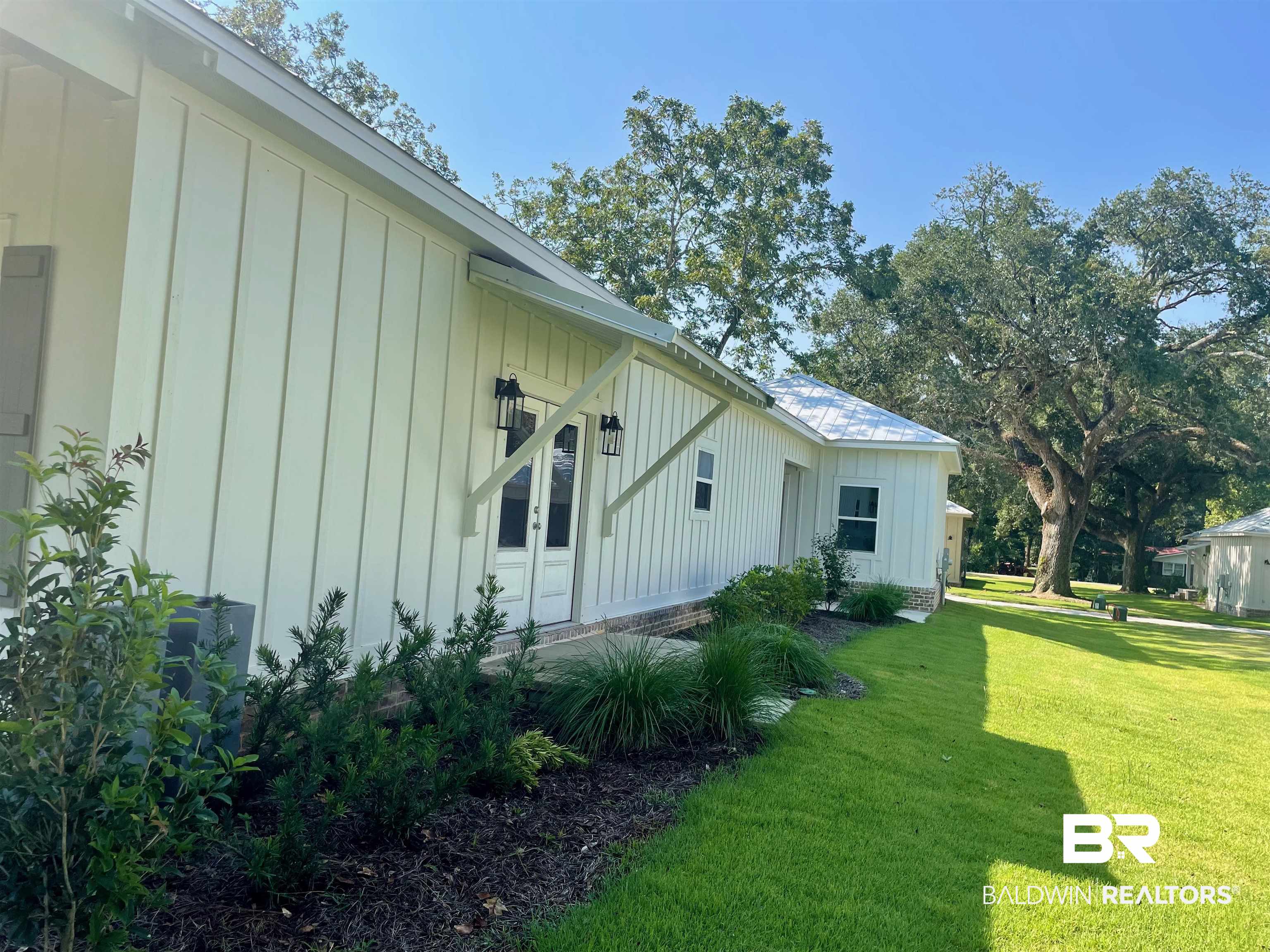 14710 Camelia Street Magnolia Springs, AL 36555 - Photo 13 of 23 View of property exterior with a yard
