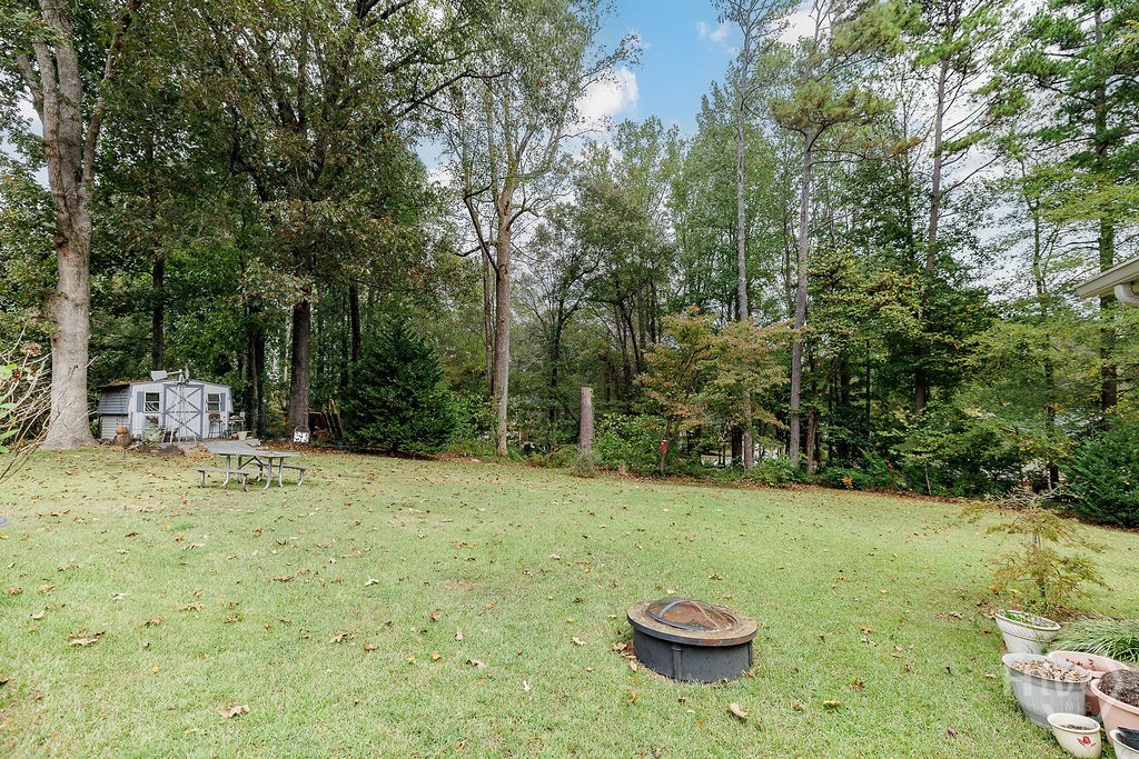 1296 Lake Lucerne Road Southwest Lilburn, GA 30047 - Photo 43 of 57 Backyard View Towards Shed