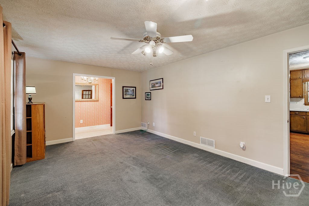 1296 Lake Lucerne Road Southwest Lilburn, GA 30047 - Photo 7 of 57 Formal Living Room / Dining Room View 3