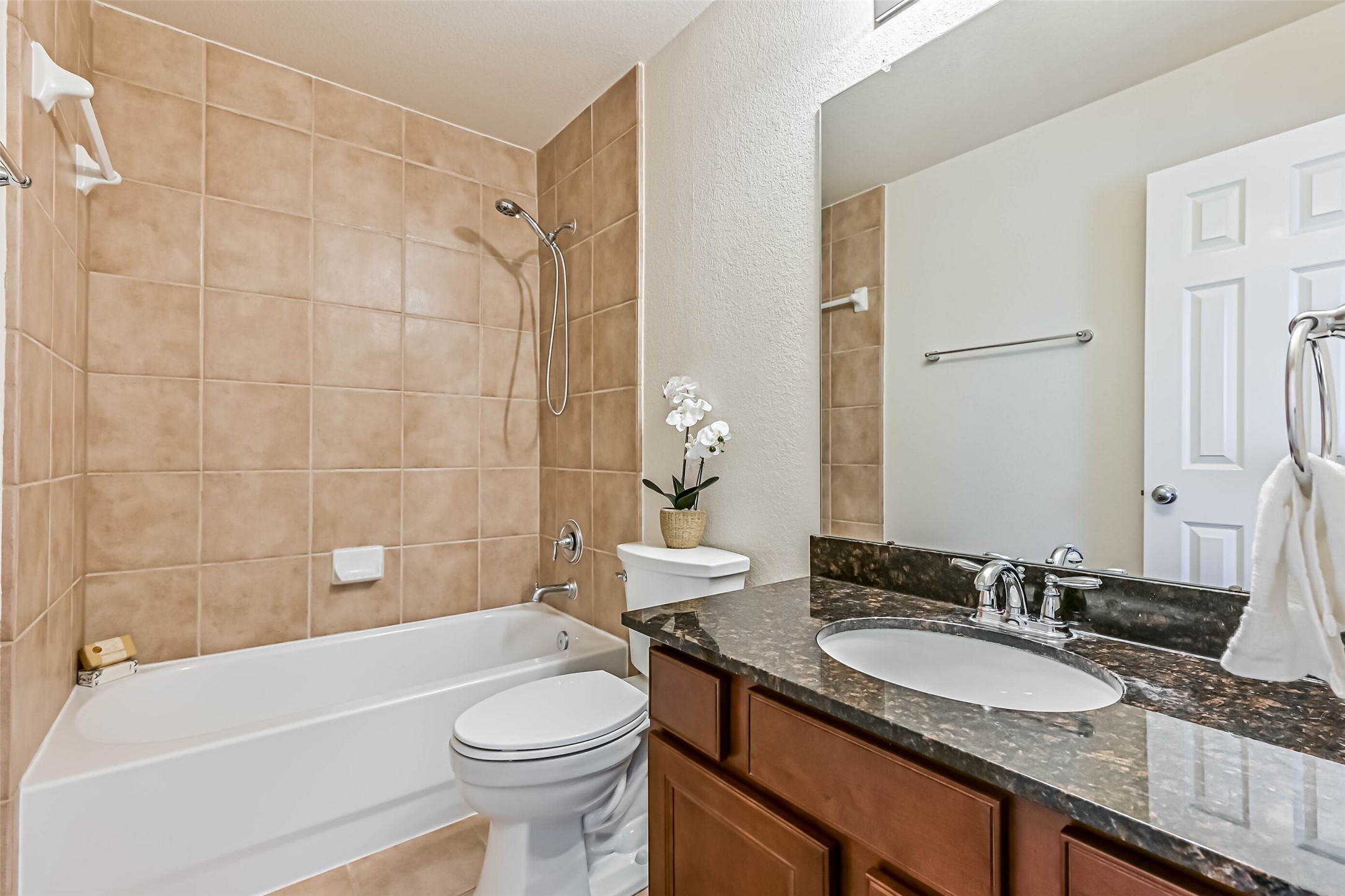 3208 Clearview Circle Houston, TX 77025 - Photo 25 of 30 a bathroom with a granite countertop sink toilet and shower