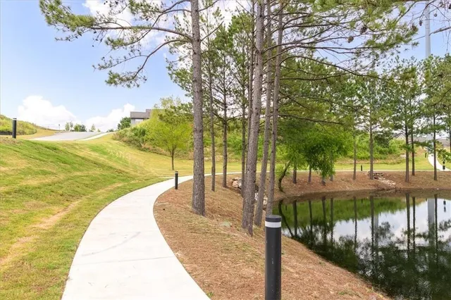 a view of a swimming pool with a patio