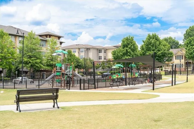 a swimming pool with outdoor seating and yard