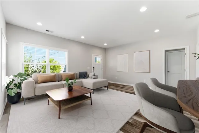 a living room with furniture and a large window