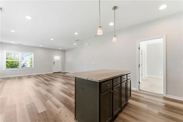 a kitchen with a sink and chandelier