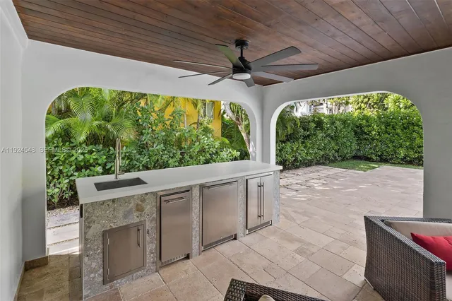 a roof deck with table and chairs