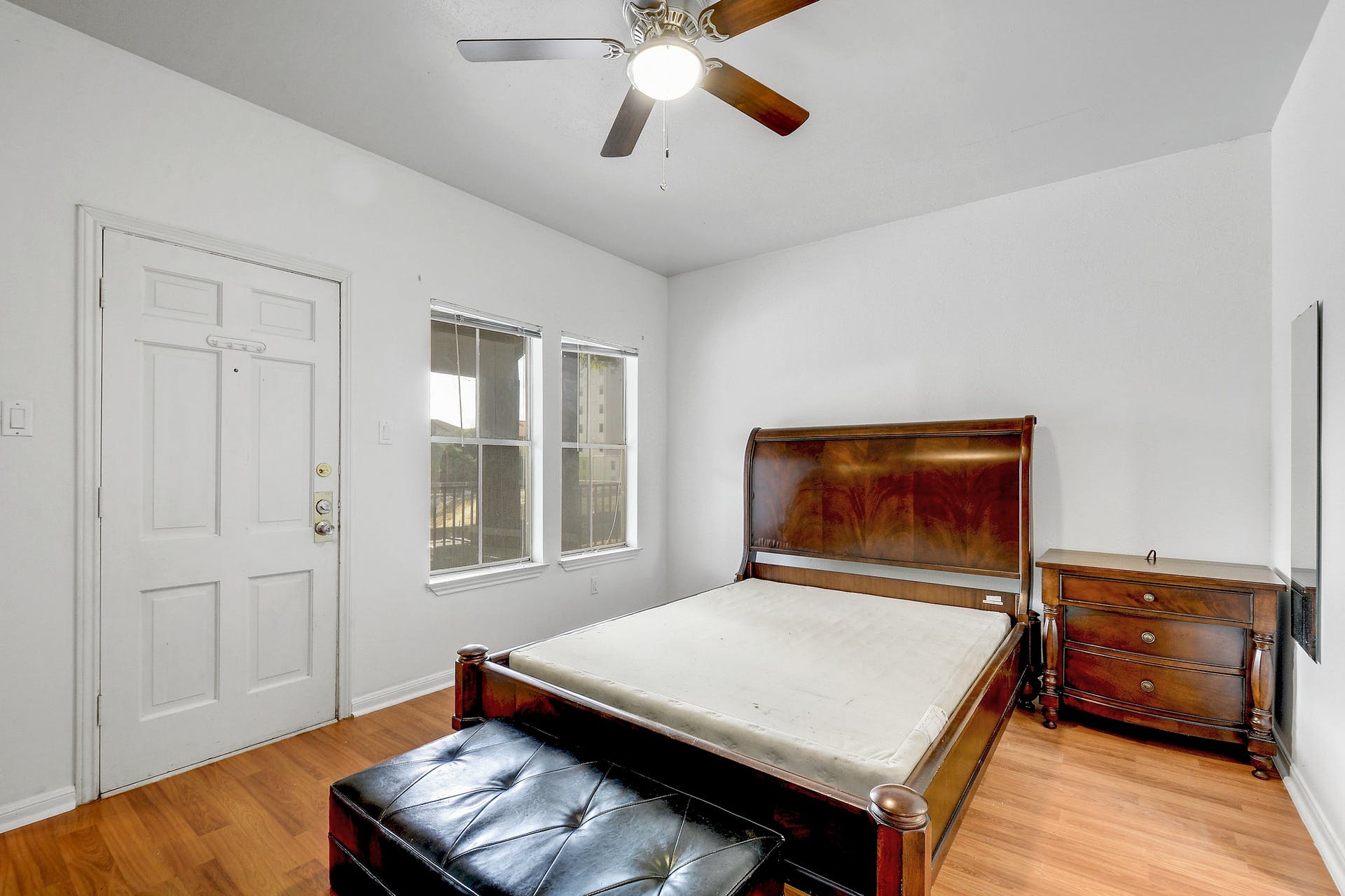 2529 Rio Grande Street, Unit 12 Austin, TX 78705 - Photo 5 of 25 a living room with a bed furniture and a window