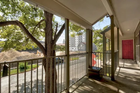 a view of a porch with wooden floor and outdoor space