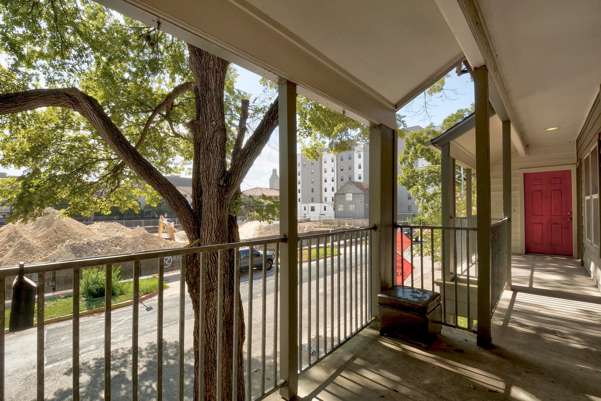 2529 Rio Grande Street, Unit 12 Austin, TX 78705 - Photo 9 of 25 a view of a porch with wooden floor and outdoor space
