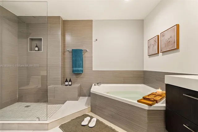 a bathroom with a tub and a shower