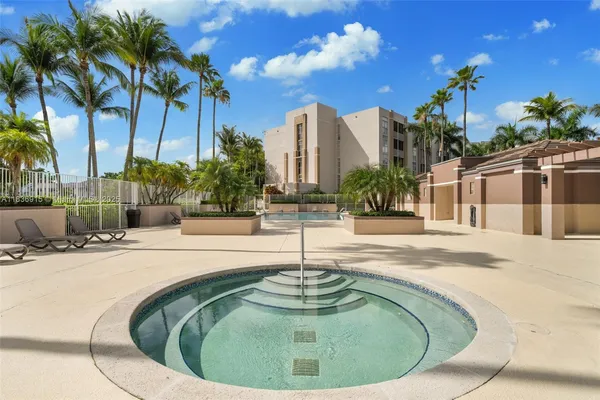 a view of a fountain in front of a house