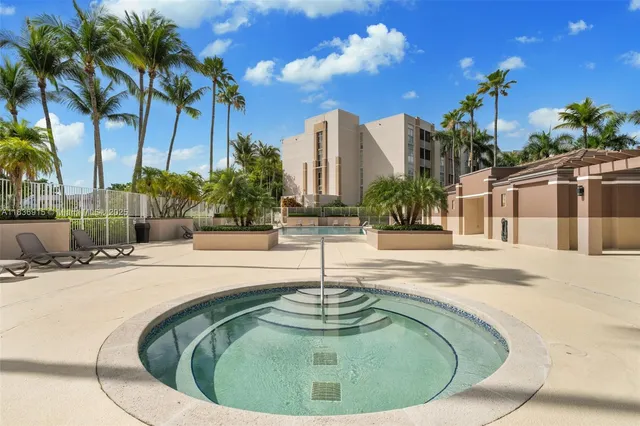 a view of a fountain in front of a house