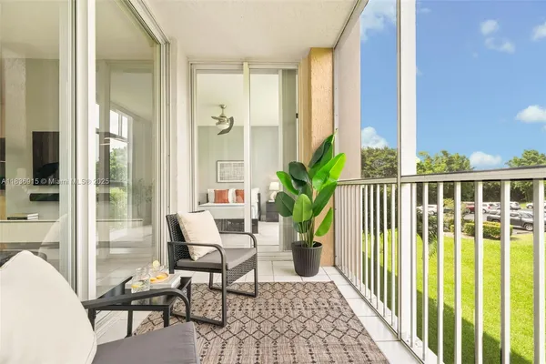 a view of a balcony with furniture