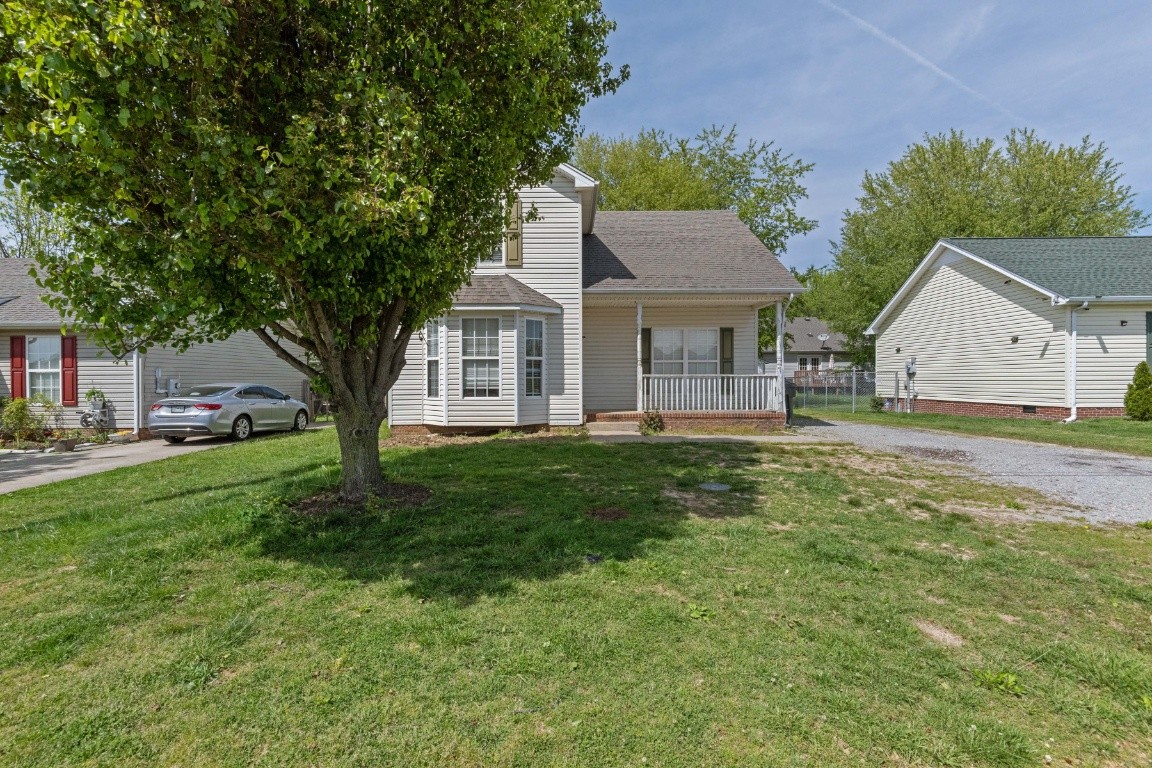 323 Bandera Lane Springfield, TN 37172 - Photo 2 of 33 a view of a house with a big yard plants and large trees