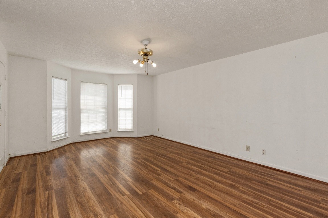 323 Bandera Lane Springfield, TN 37172 - Photo 4 of 33 wooden floor in an empty room with a window