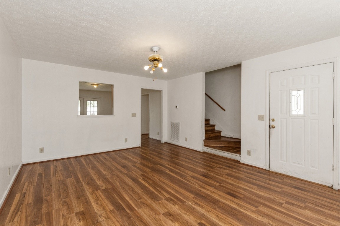 323 Bandera Lane Springfield, TN 37172 - Photo 6 of 33 wooden floor in an empty room with a window