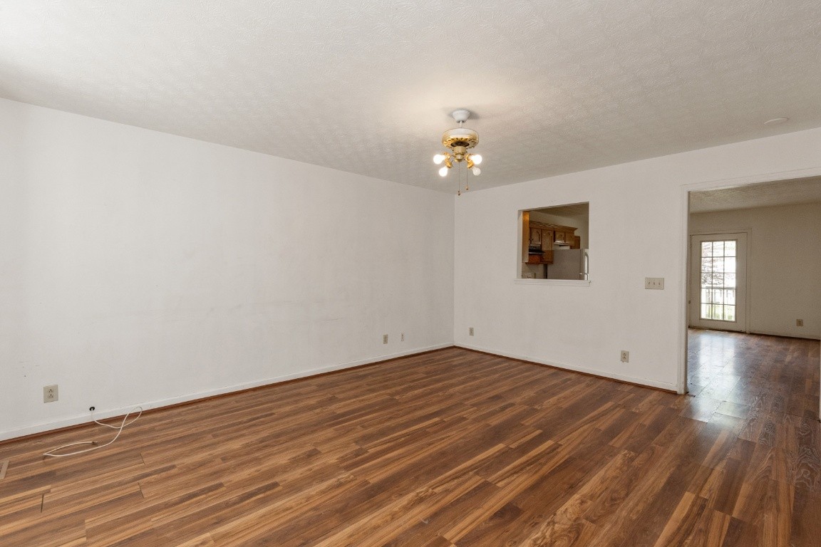 323 Bandera Lane Springfield, TN 37172 - Photo 7 of 33 wooden floor in an empty room with a window