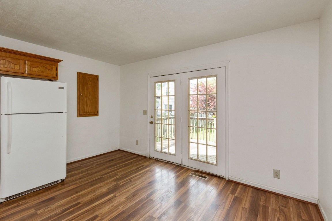 323 Bandera Lane Springfield, TN 37172 - Photo 10 of 33 a view of an empty room with wooden floor and a window