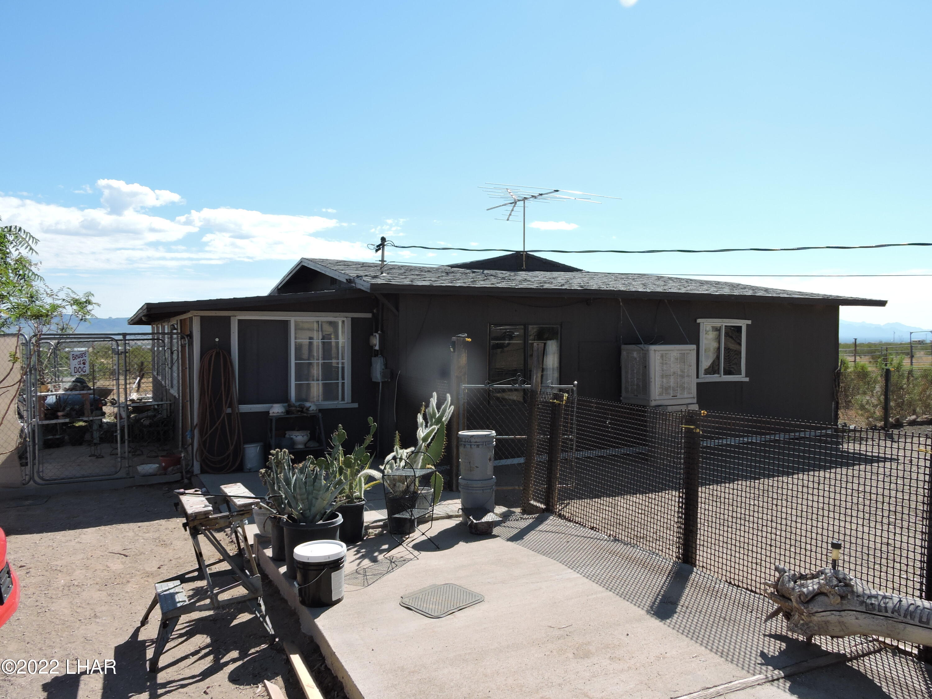 1566 South Elfrida Road Golden Valley, AZ 86413 - Photo 26 of 45 a front view of a house with patio