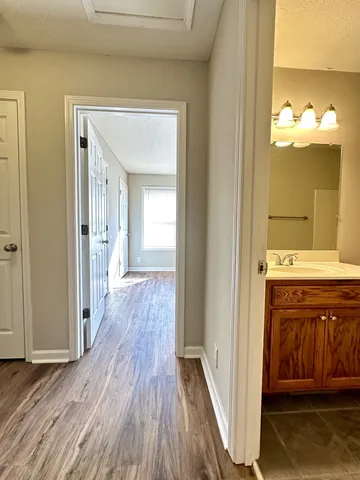 a view of a bathroom from a hallway