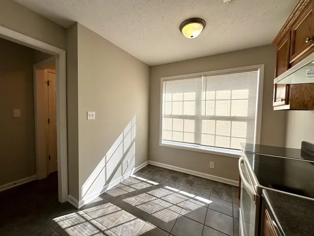 a view of a kitchen with a sink and a window