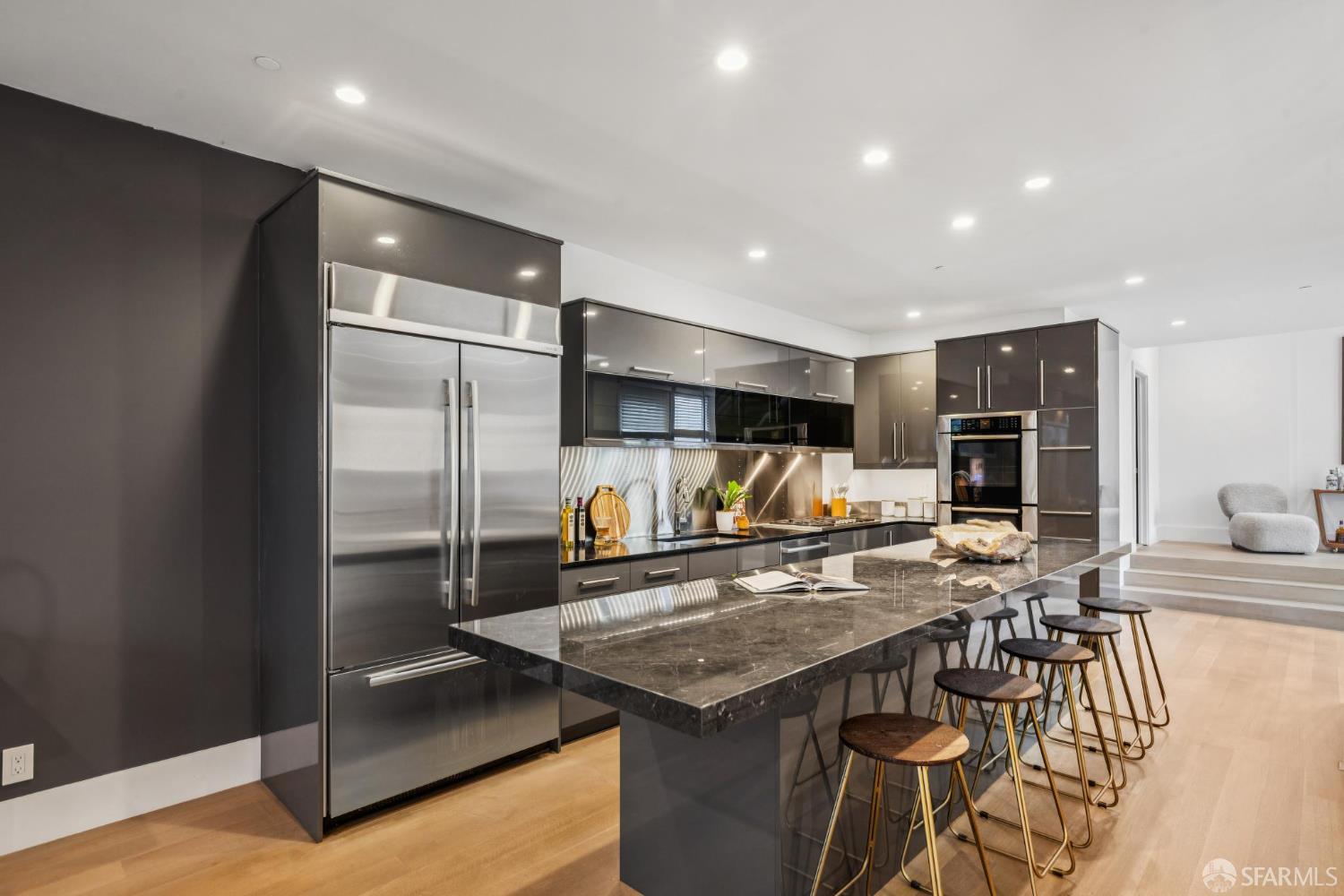 1533 Pacific Avenue San Francisco, CA 94109 - Photo 25 of 58 a kitchen with stainless steel appliances granite countertop a sink and a refrigerator