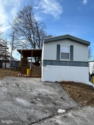 a house with trees in the background