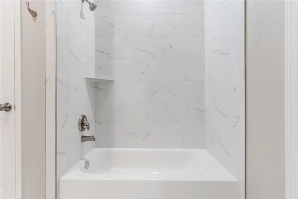 a close up of a bathtub curtain