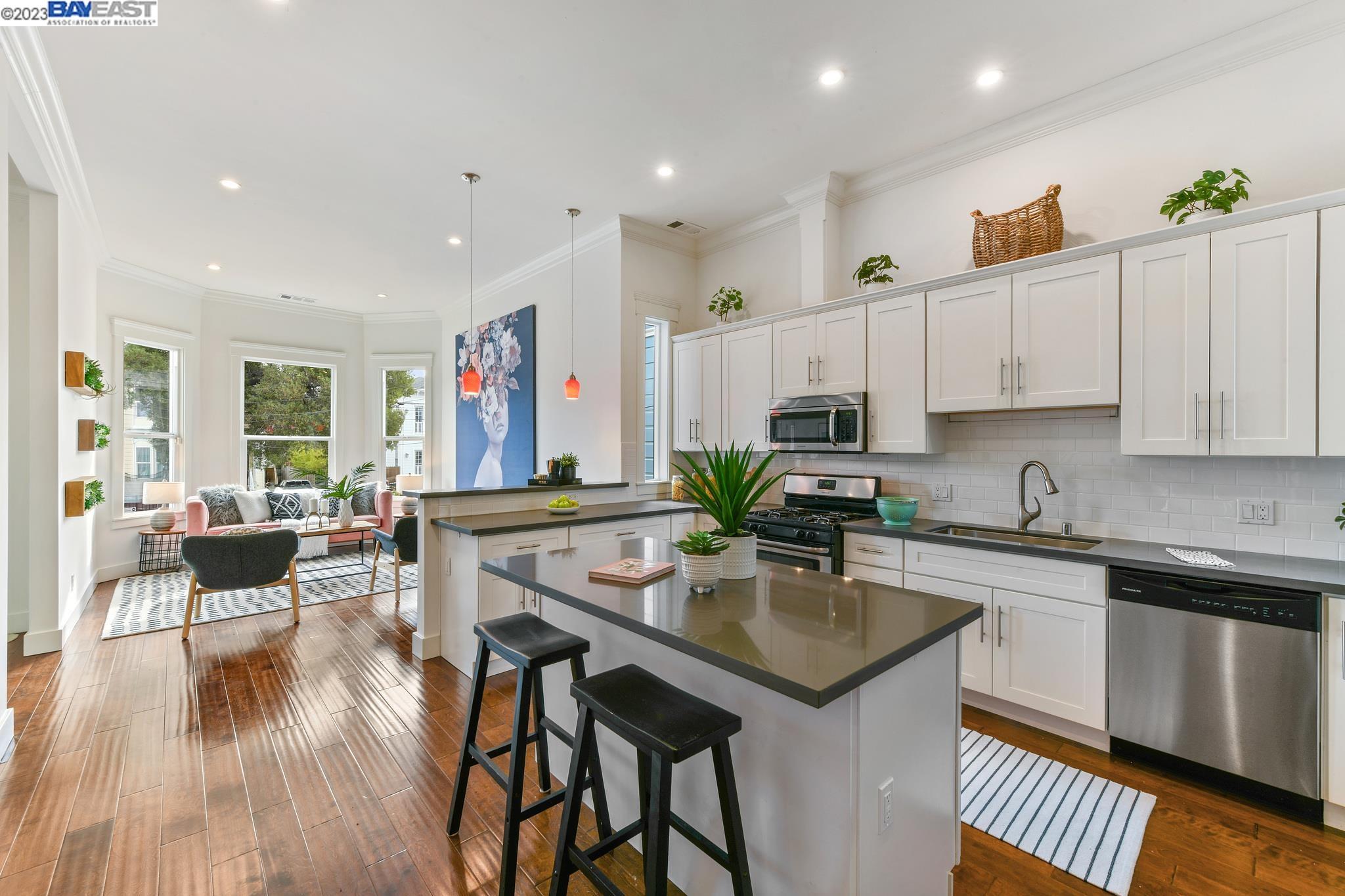 a kitchen with stainless steel appliances granite countertop a refrigerator and microwave