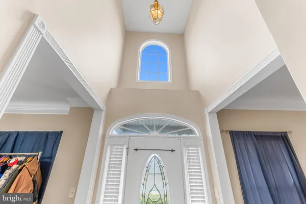 a front view of a house with entryway and wooden floor