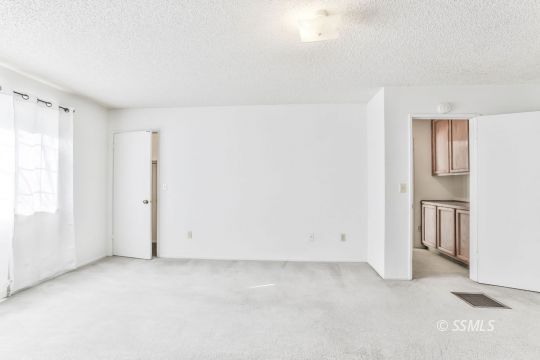101 South Lilac Street Ridgecrest, CA 93555 - Photo 14 of 26 an empty room with windows