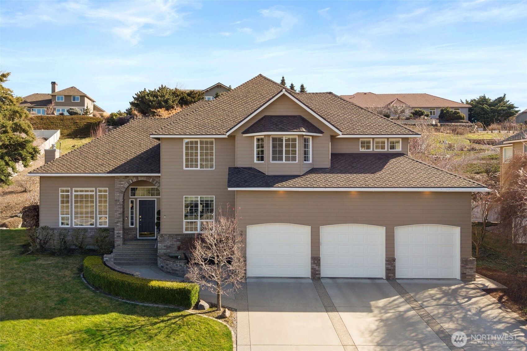 front view of a house with a yard