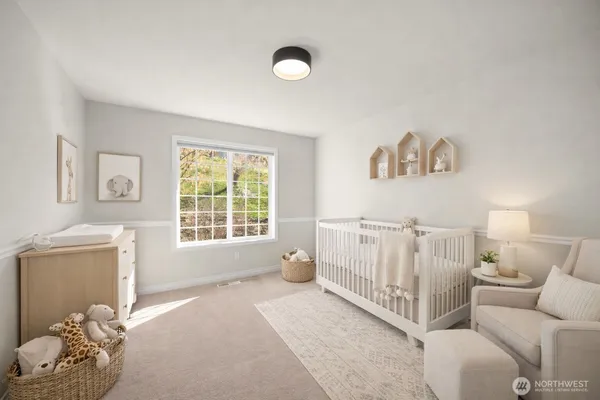 a bedroom with furniture and a window