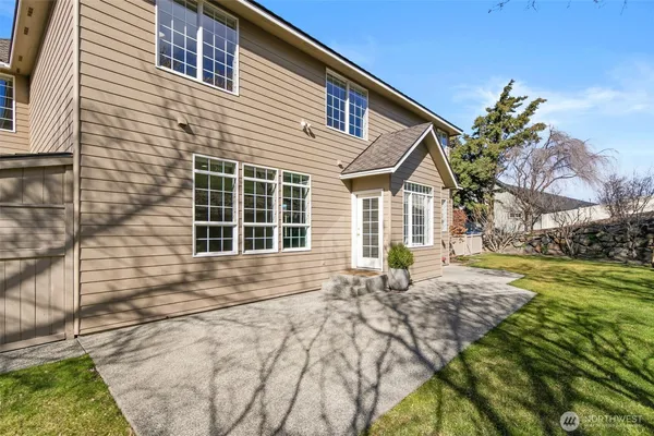 a house view with a backyard space