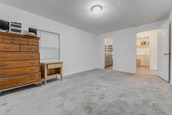 a view of an empty room and fire place