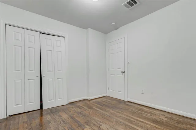 a utility room with dryer washer and a view of living room