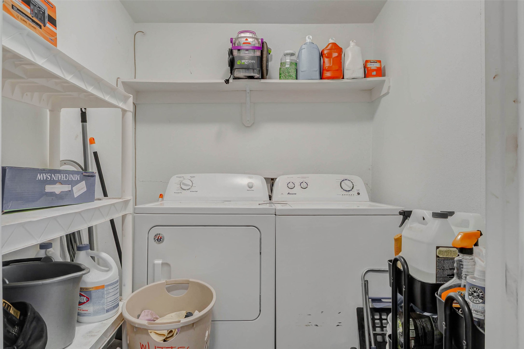 907 Whitaker Avenue Pasadena, TX 77506 - Photo 25 of 35 a utility room with dryer washer and a view of living room