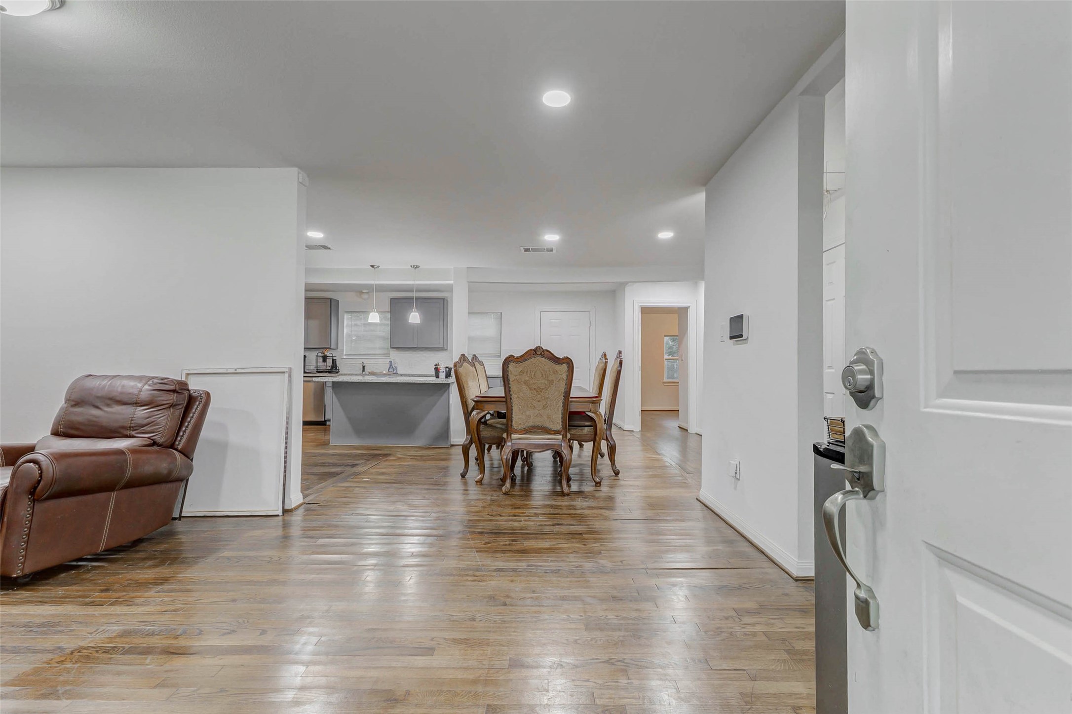 907 Whitaker Avenue Pasadena, TX 77506 - Photo 3 of 35 a living room with furniture and a dining table with kitchen view