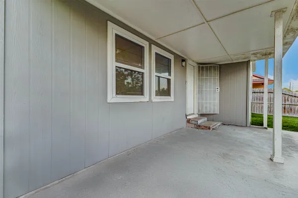 an empty room with wooden door