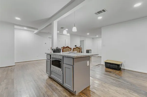 a view of kitchen with sink microwave and stove